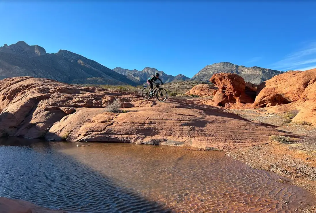 Mountain bikers riding through Southern Nevada desert landscape